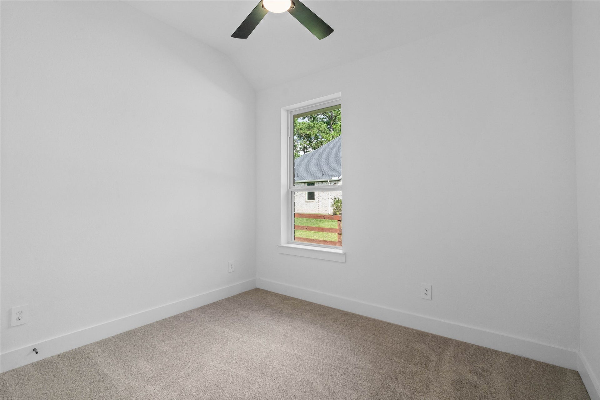 17728 Gold Saddle Lane, Magnolia, TX 77354 This versatile secondary bedroom offers a bright, neutral canvas with plush carpet flooring and light walls, creating a welcoming and adaptable space for guests, a home office, or a growing family.