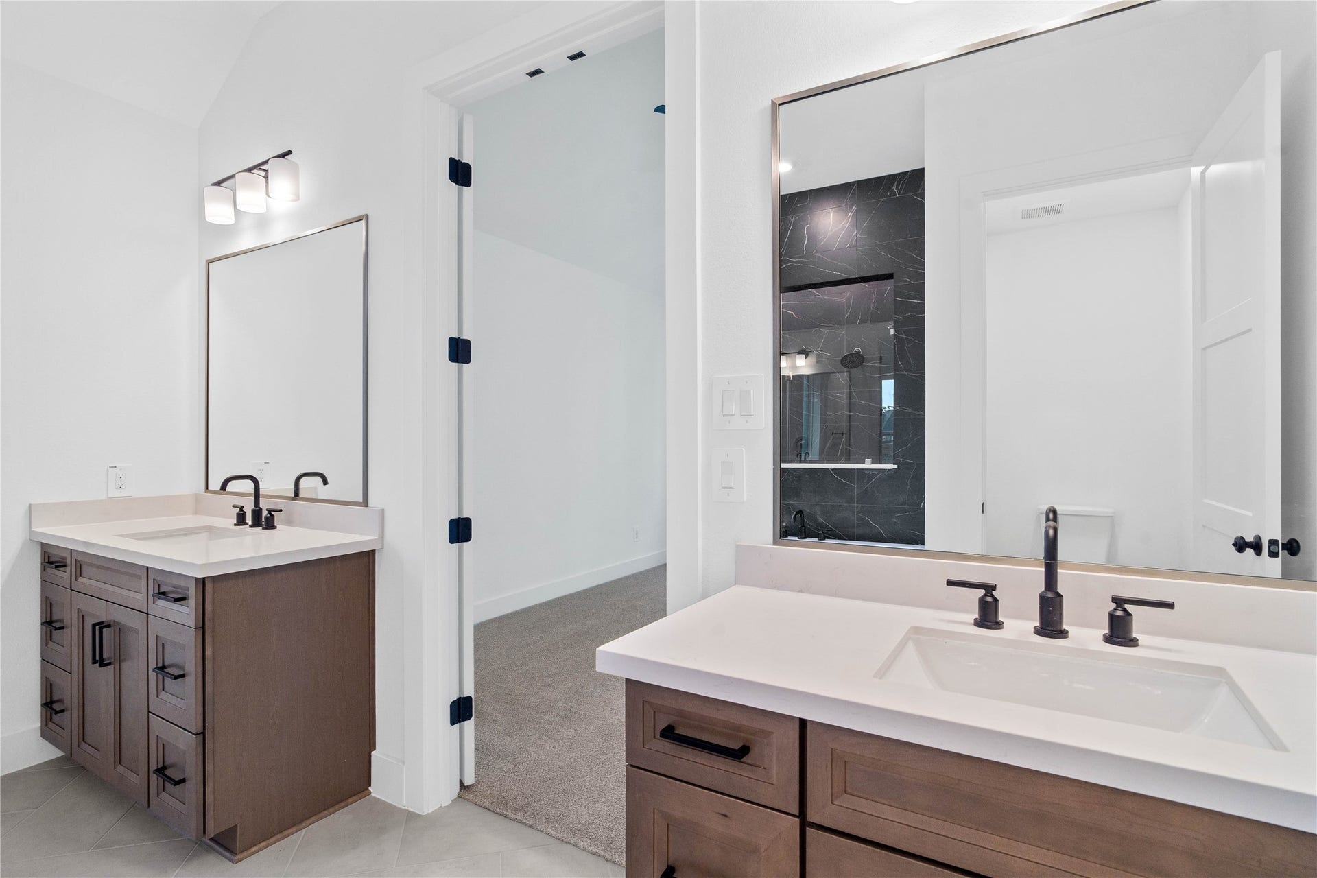 17728 Gold Saddle Lane, Magnolia, TX 77354 This stunningly updated primary bathroom is truly move-in ready! It features gorgeous painted dual vanity cabinetry with light countertops, large framed mirrors, soaring ceilings, custom paint, and sleek modern fixtures.