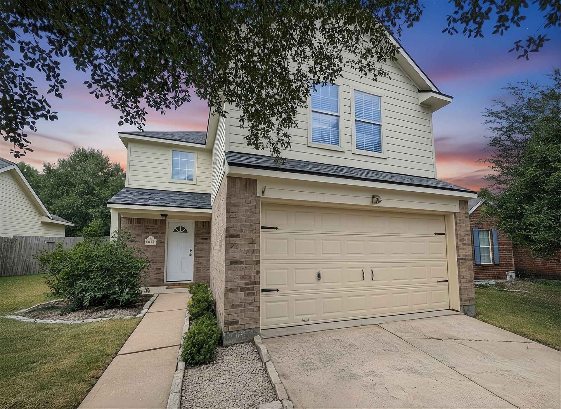 2019 Briar Grove Drive, Conroe, TX 77301 This beautiful home offers a brand new front door and an inviting exterior with mature landscaping, a spacious front yard, and timeless charm.
