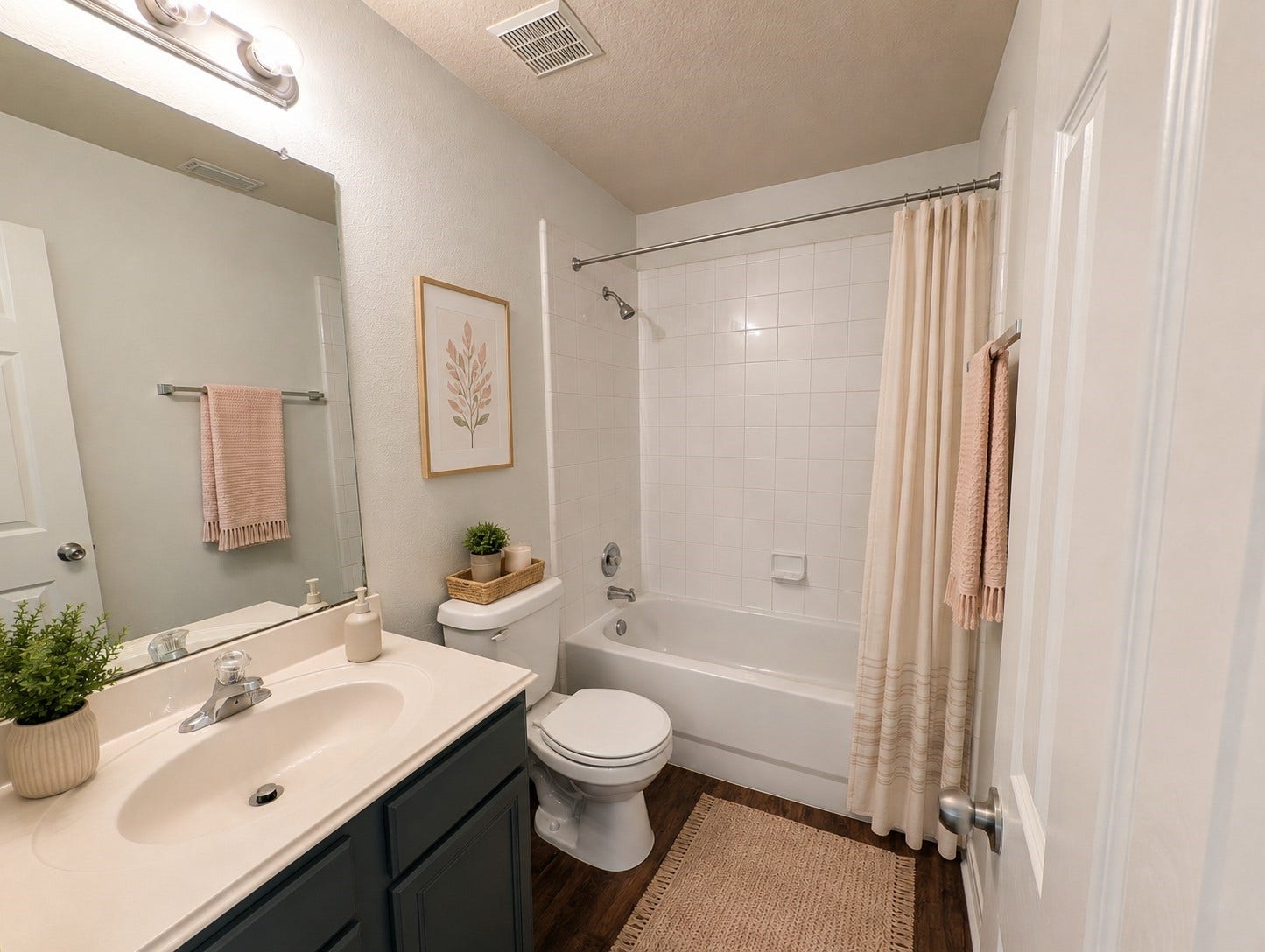 2019 Briar Grove Drive, Conroe, TX 77301 The inviting guest bath has been lightly virtually staged to illustrate how simple touches can create a warm and inviting space.
