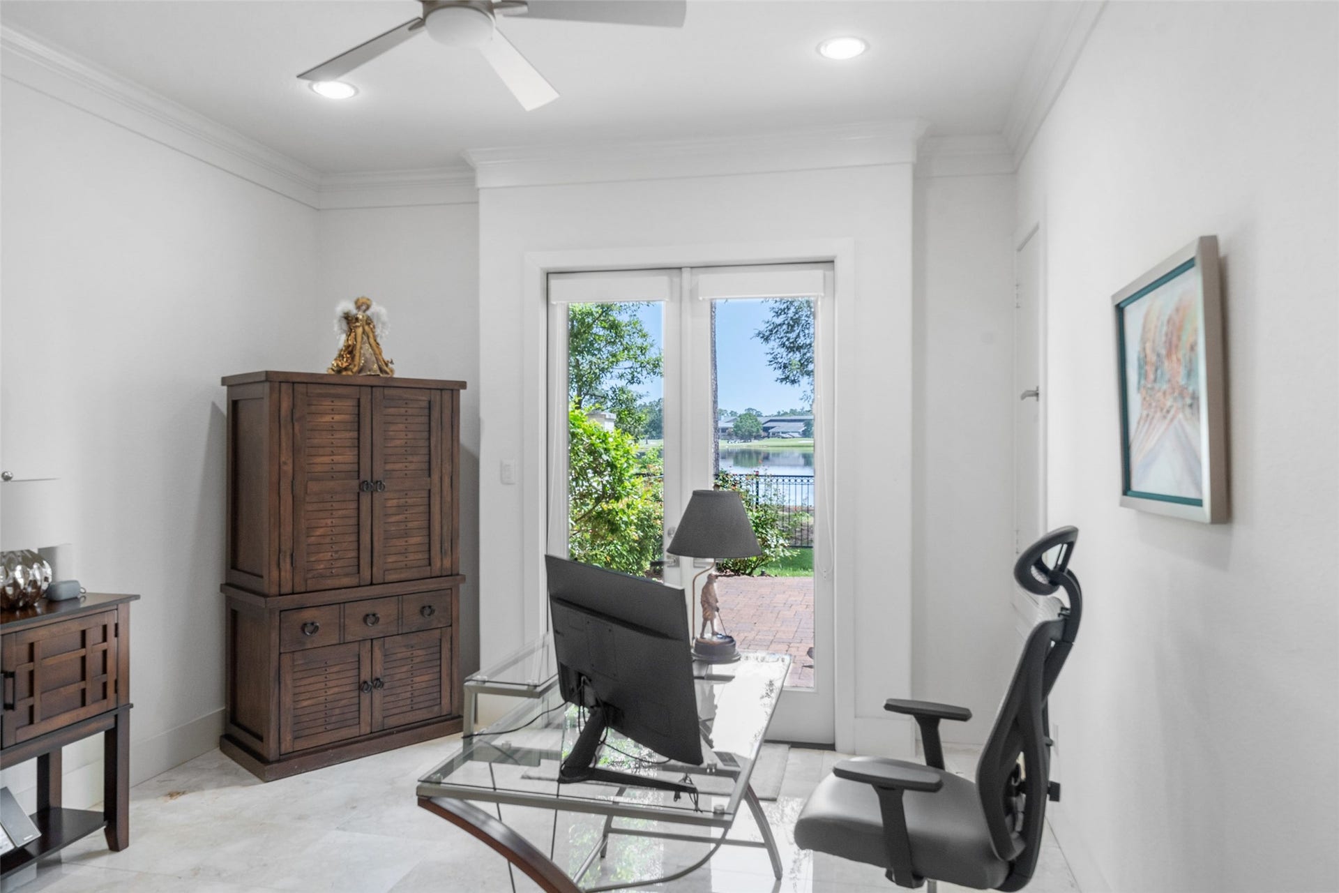 18 Secluded Trail, The Woodlands, TX 77380 EFFICIENT OFFICE WITH WALK OUT TO THE BACKYARD WITH ITS VIEWS FOR TAKING A NEEDED BREAK AND ENJOYING THE LAKE OR GOLF