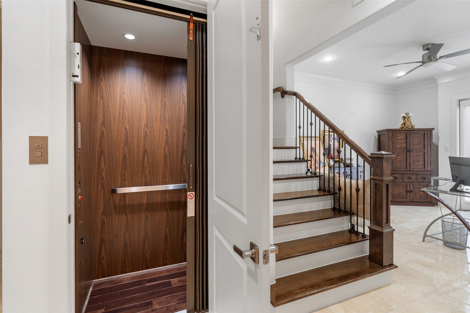 18 Secluded Trail, The Woodlands, TX 77380 ENTER INTO THE PRIVATE LOWER LEVEL WITH BEDROOM, En-SUITE BATH, OFFICE AND ELEVATOR WITH ACCESS TO ALL FLOORS