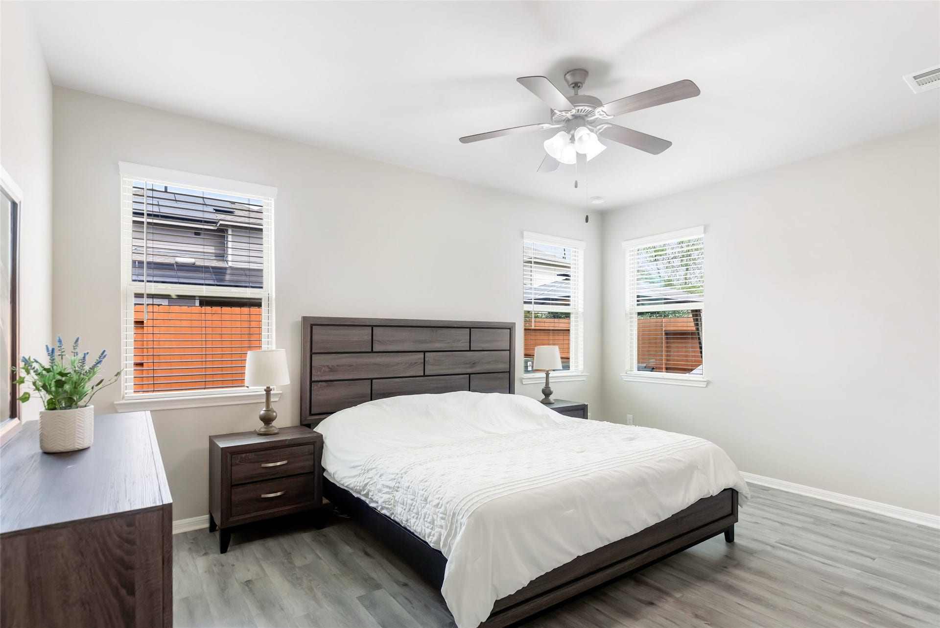 Spacious first-floor primary bedroom offers a peaceful retreat with generous room for furnishings.