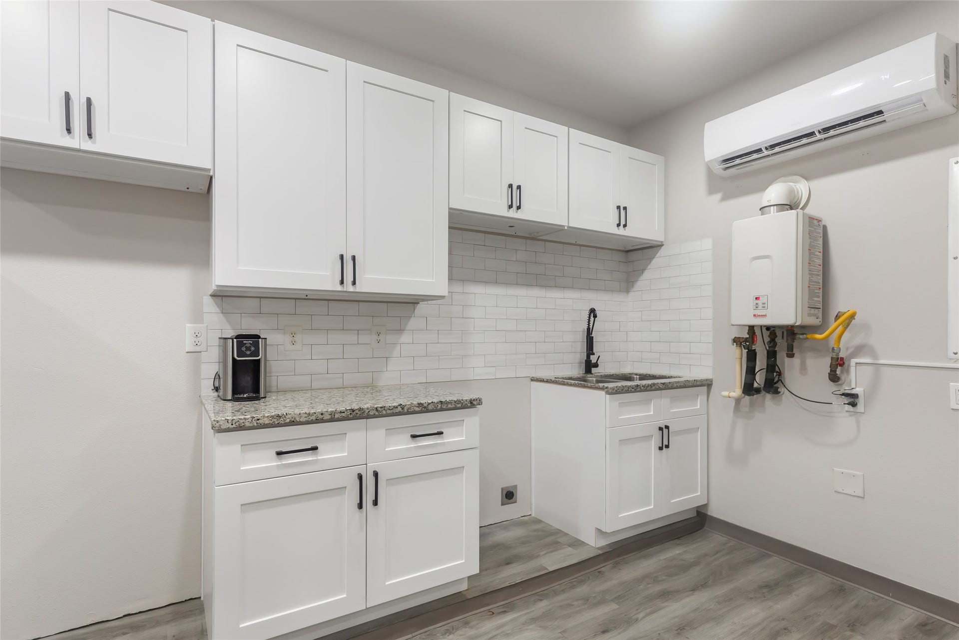 Convenient kitchenette adds functionality to the home's versatile additional living space.