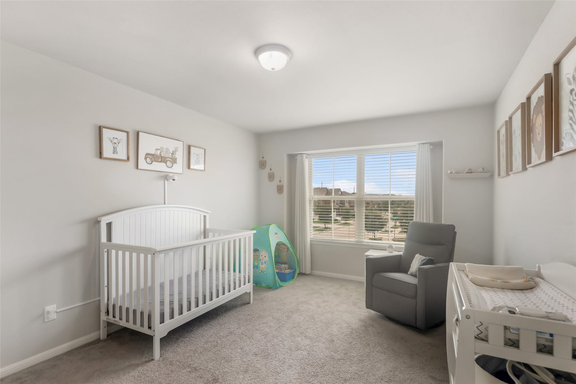 Bright secondary bedroom provides comfortable living space with generous closet storage.
