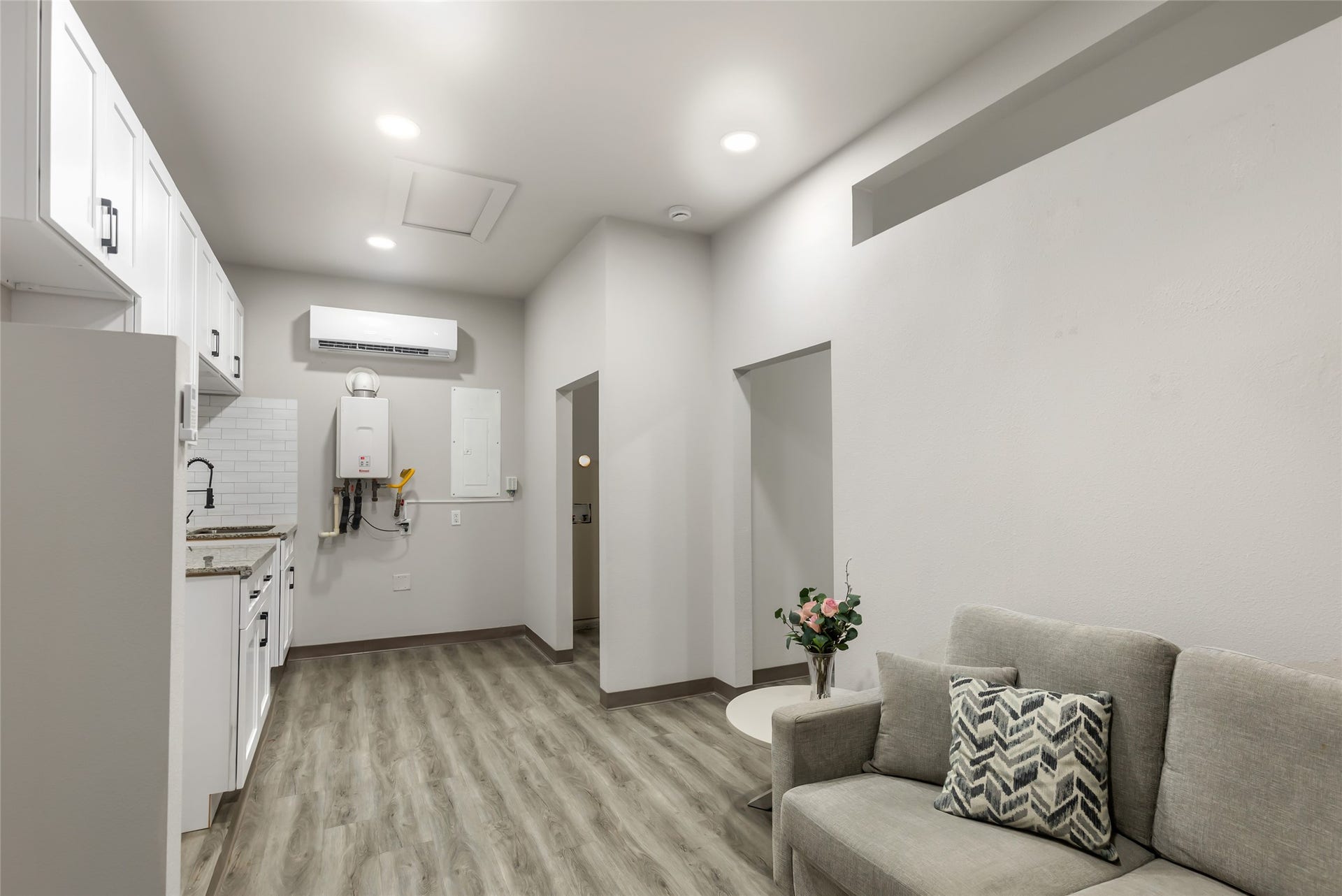 Spacious converted garage offers a versatile living area with kitchenette, flex room/office and full bathideal for guests, multigenerational living, a roommate, office or private retreat.