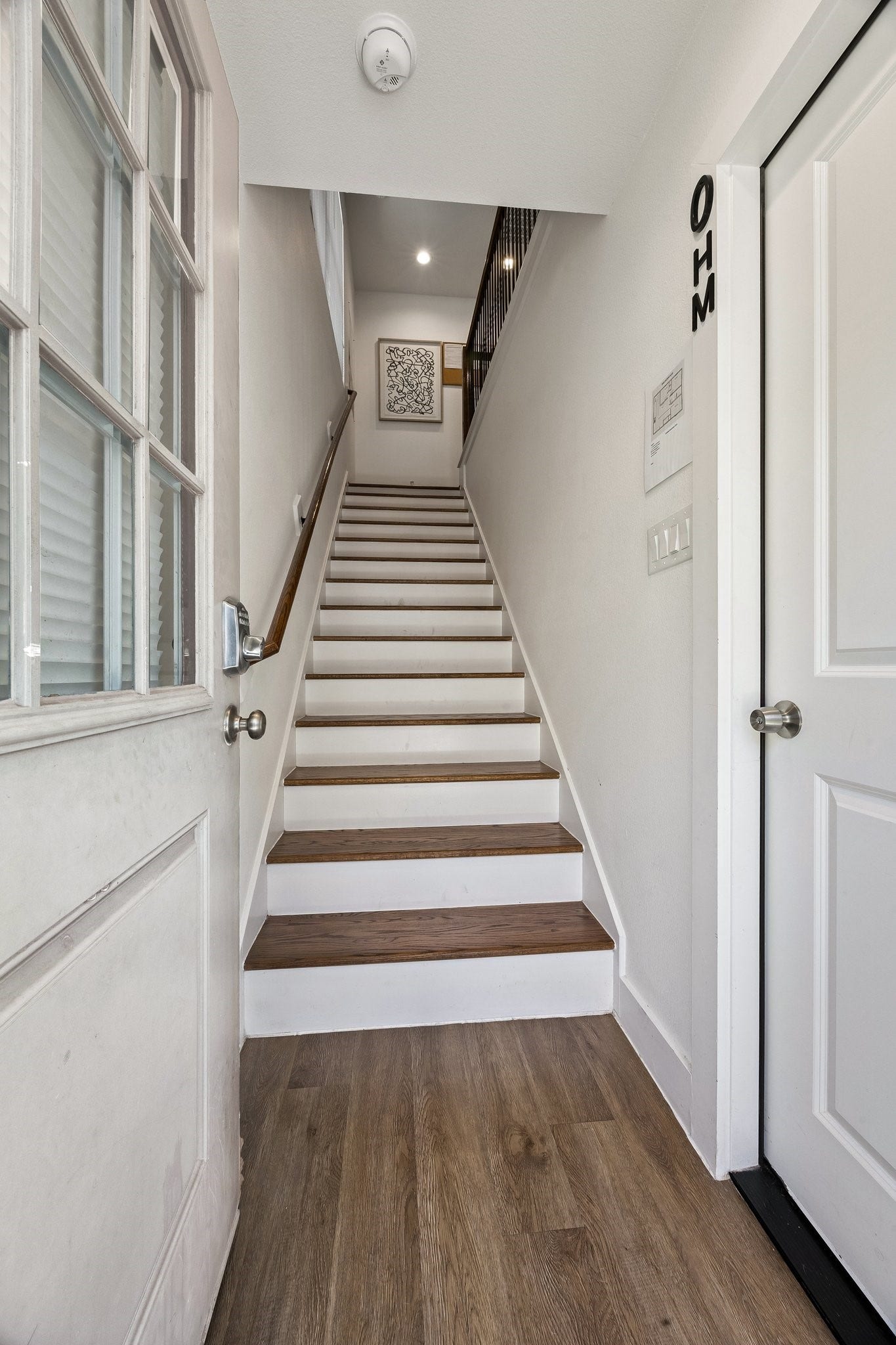 Staircase leading up to the Four bedrooms garage unit.