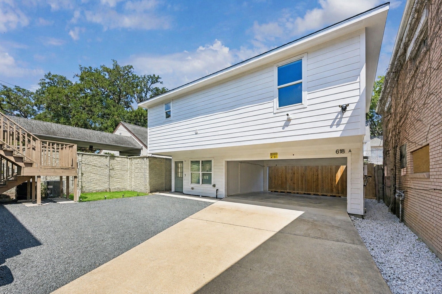 The recently built Four bedrooms, Two and a half bathrooms detached garage apartment featuring the attached port-cochere for additional parking space