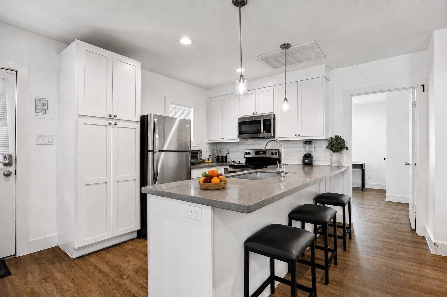 Front unit Second floor spacious kitchen with breakfast bar, pullout seating and abundant storage space