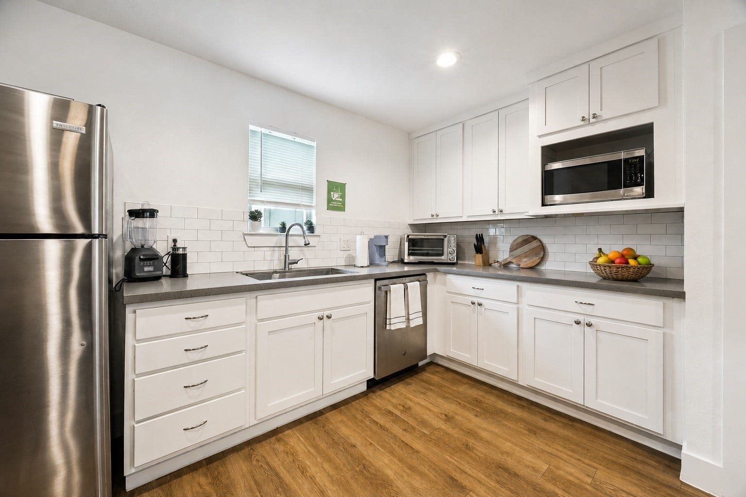 Garage unit fully equipped kitchen with abundant storage space and natural light