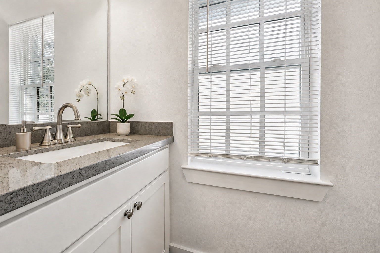 One of the two half bathrooms located in the Front second floor unit.