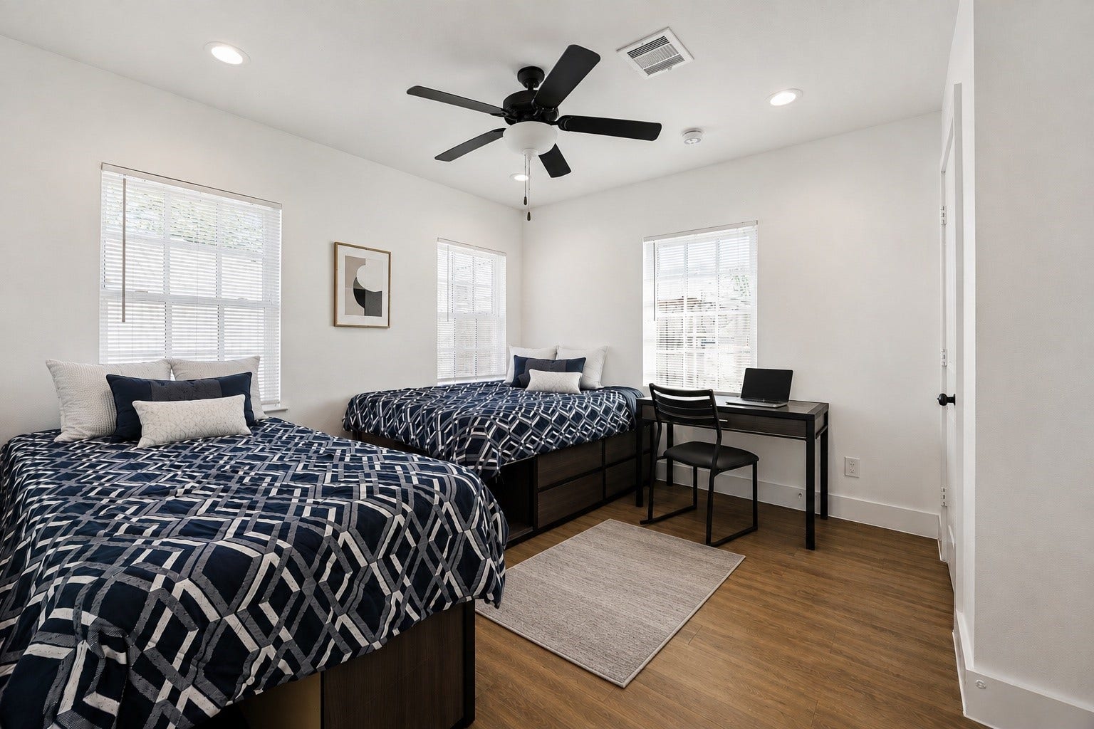 One of the Five bedrooms on the Second floor Front unit that easily adapts for sleeping and working