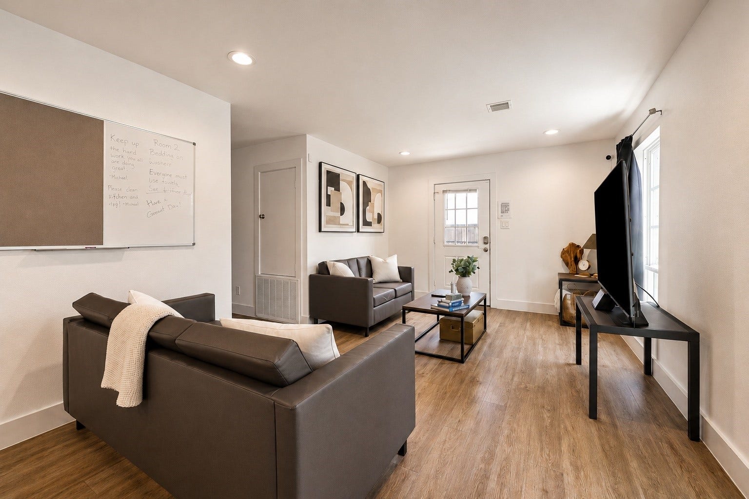 First floor Front unit living space featuring light-filled layout