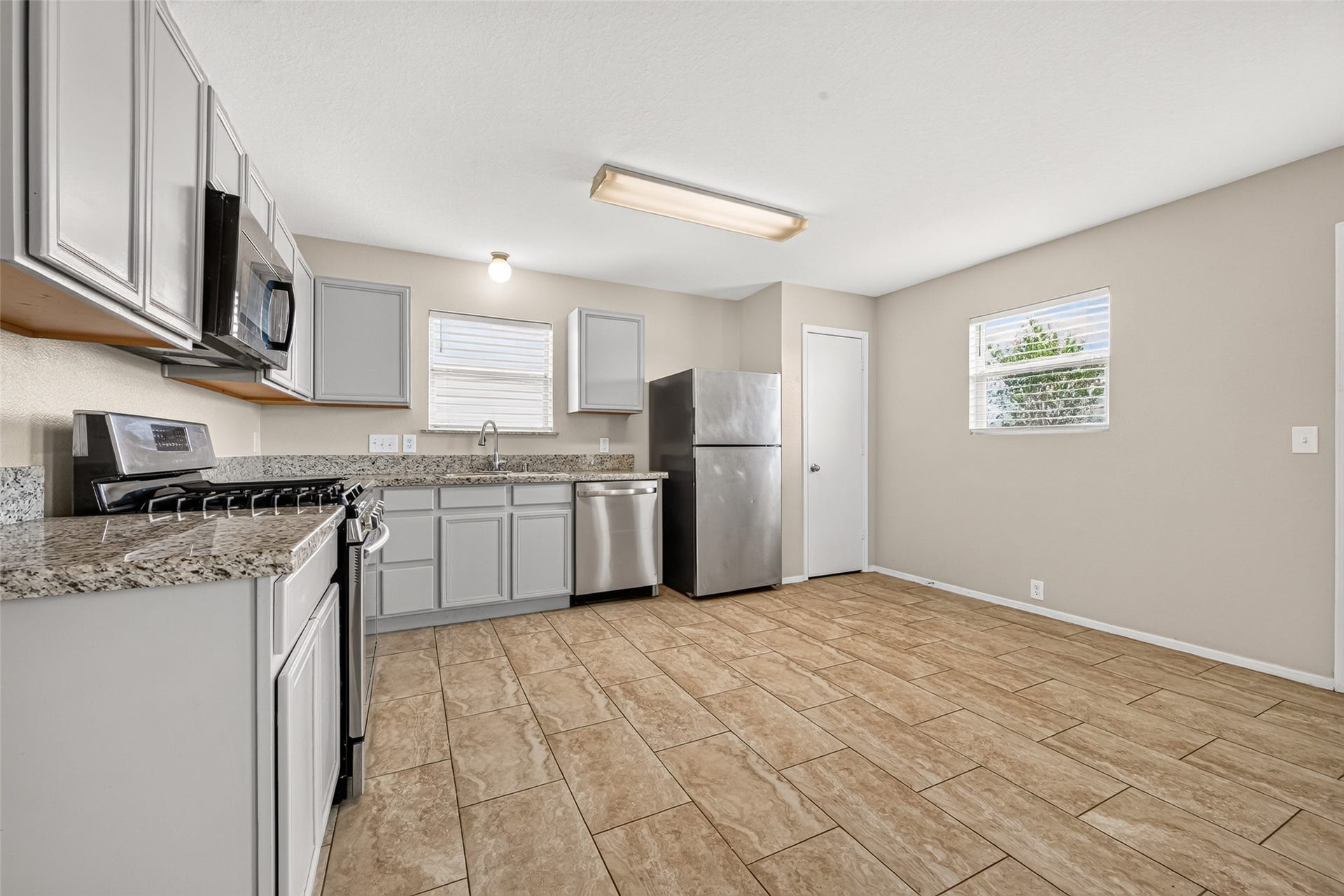 3203 Becker Glen Street, Fresno, TX 77545 The Kitchen features ample counter space and stainless steel appliances