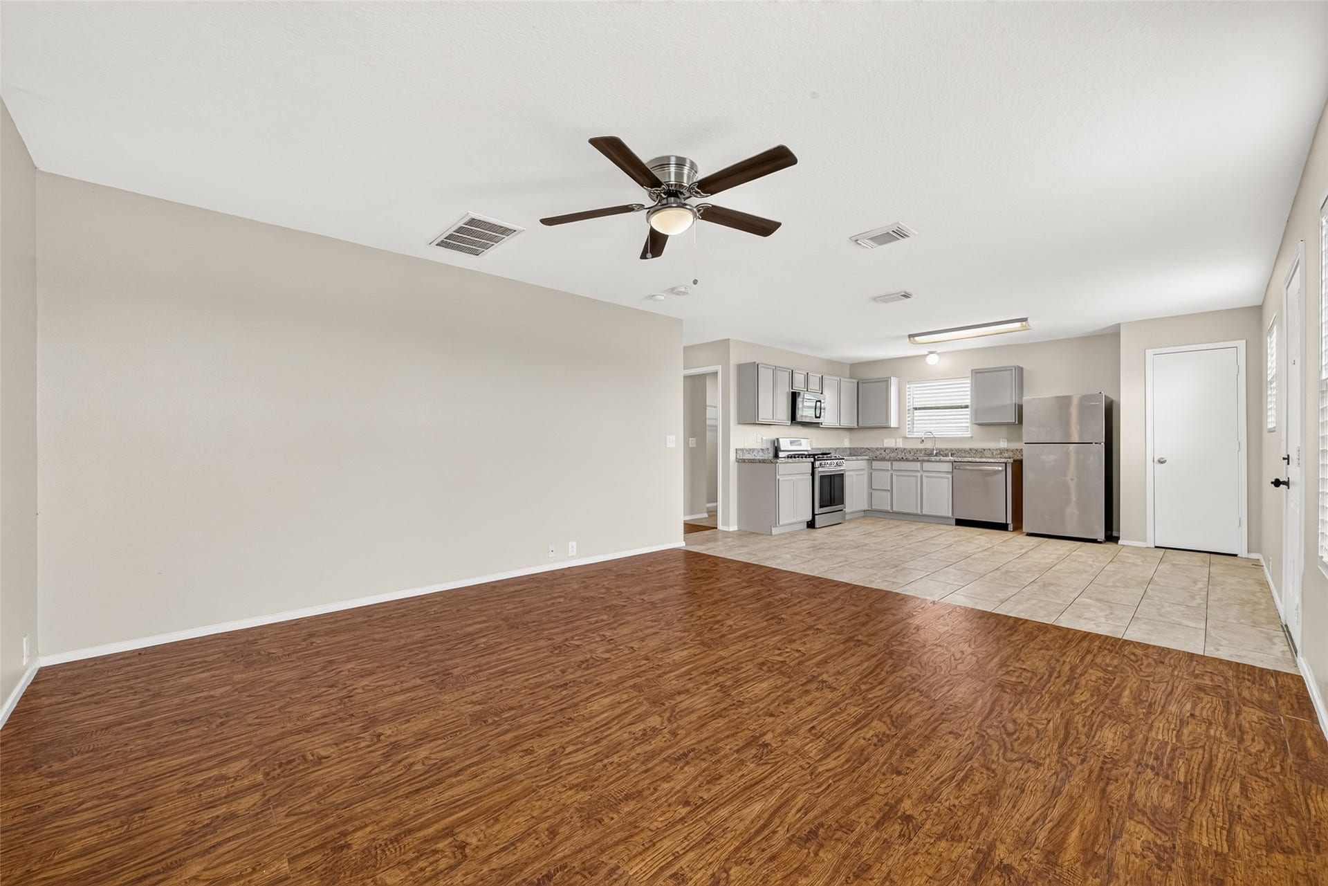 3203 Becker Glen Street, Fresno, TX 77545 Spacious second living room featuring an open-concept layout that flows seamlessly into the kitchen and breakfast area