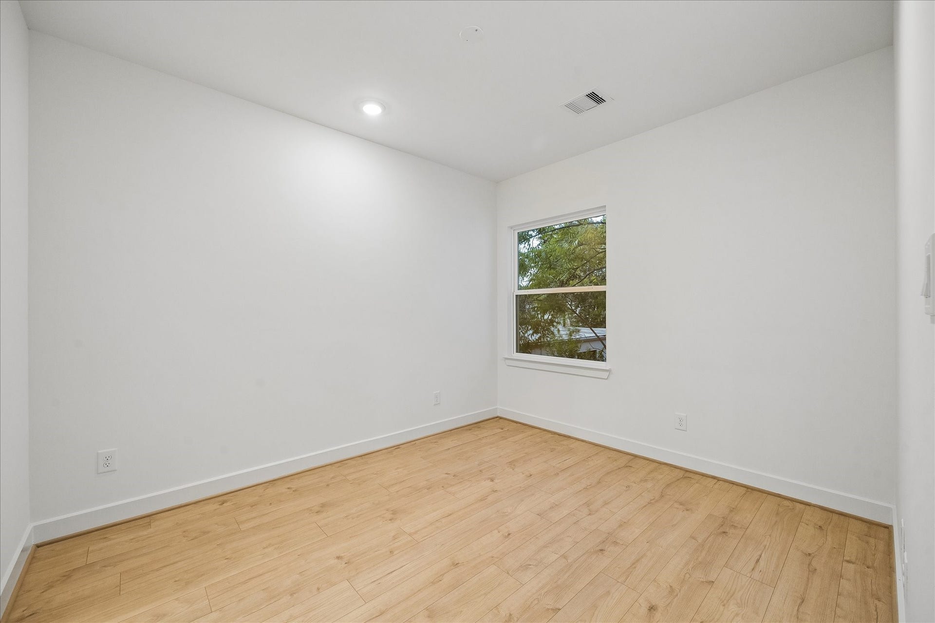 One of two secondary bedrooms.
