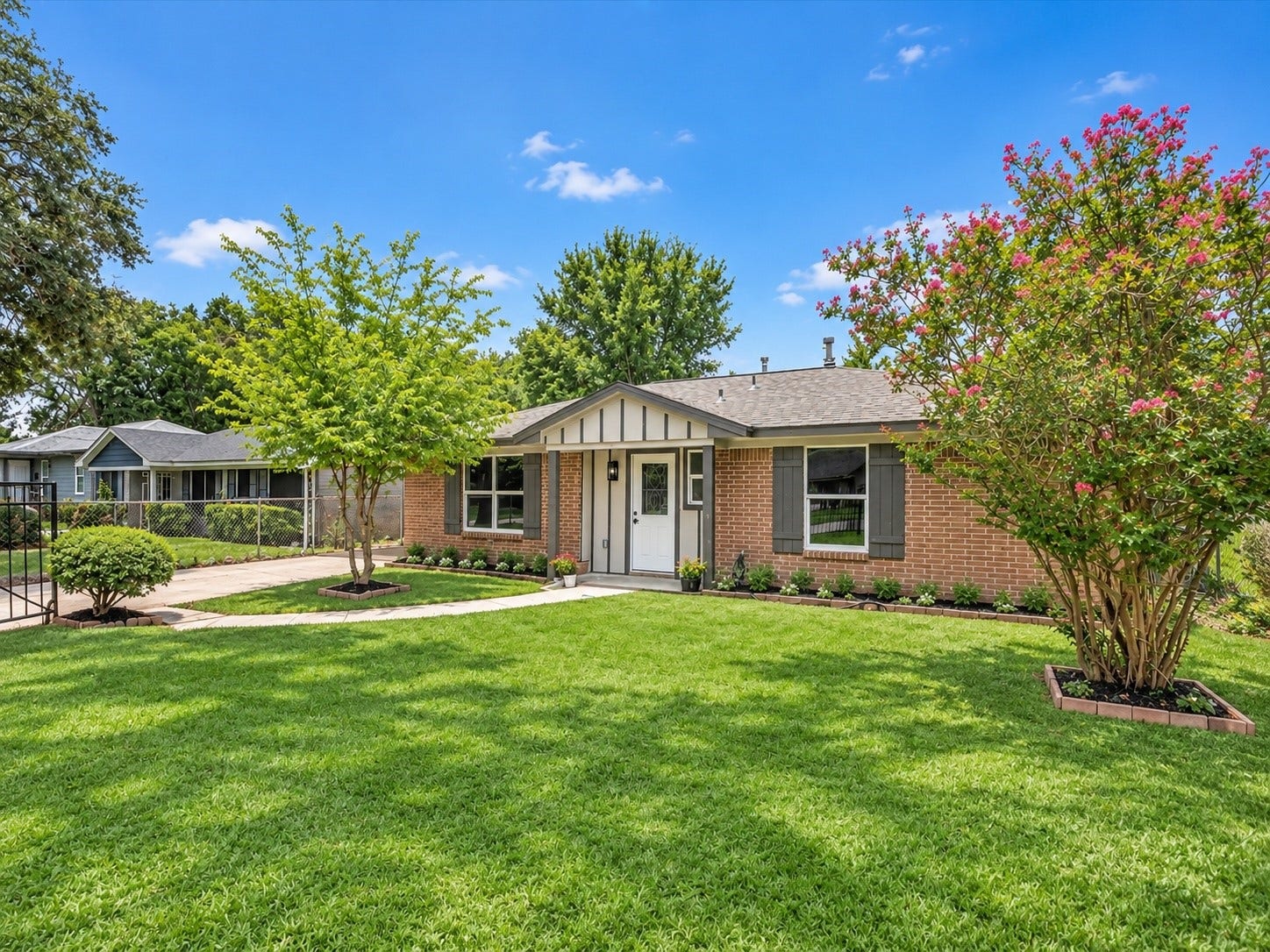5039 Briscoe Street, Houston, TX 77033 Charming one-story home with mature landscaping, spacious front lawn, and inviting curb appeal.