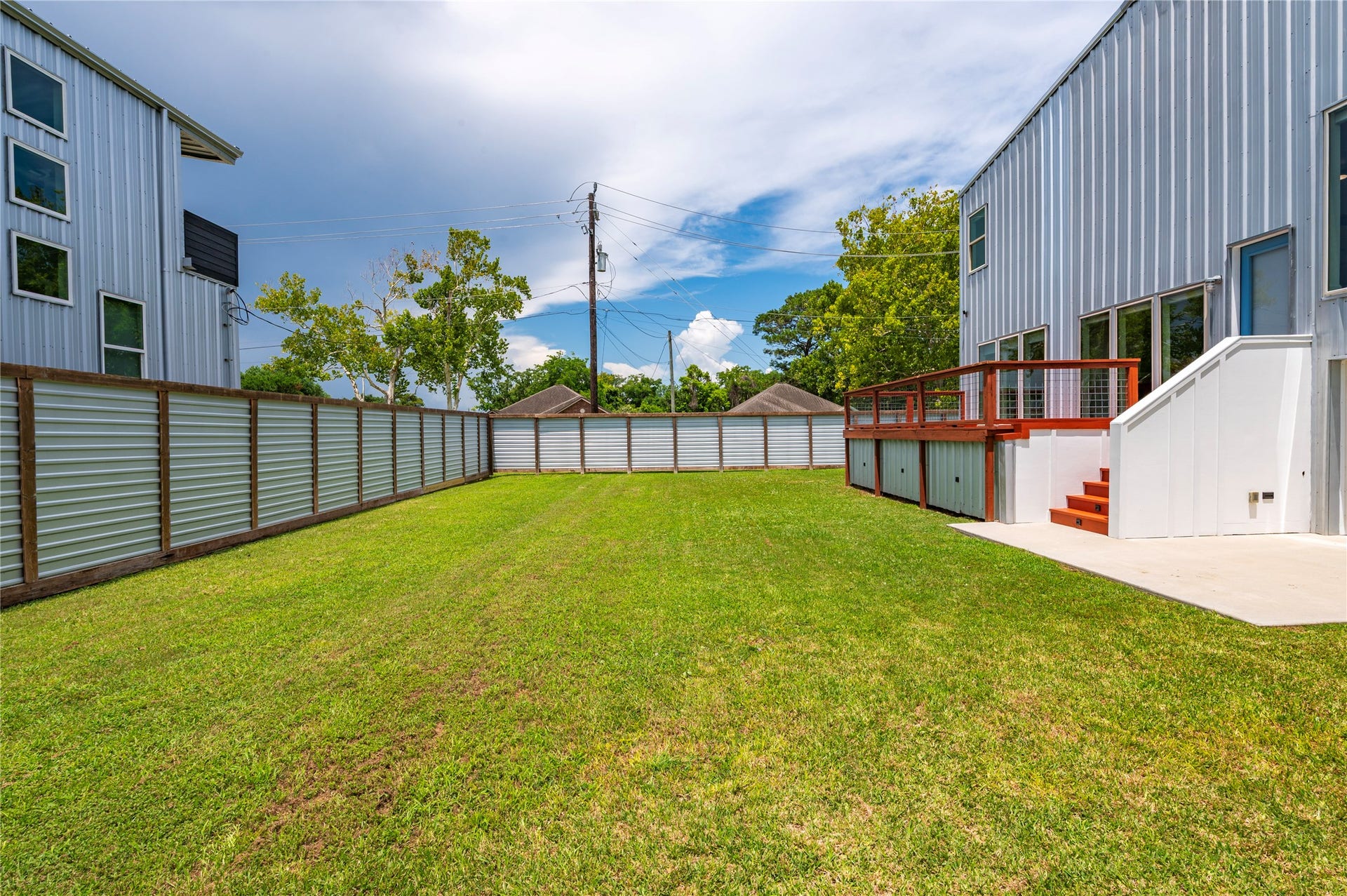 13149 W 6th Street, Santa Fe, TX 77510 8' tall fencing made from cedar, exterior pine, and metal.