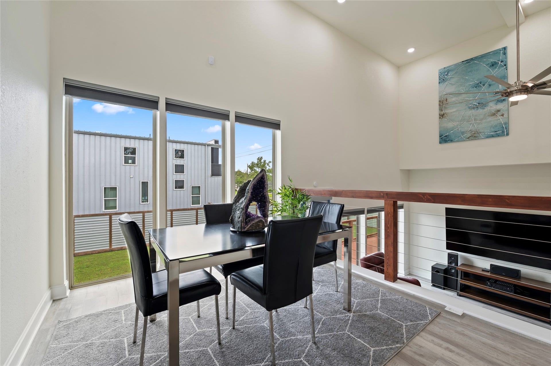13149 W 6th Street, Santa Fe, TX 77510 Elevated formal dining area is a versatile flex area and could be used as home-gym or second home-office. This area also features upscale dual directional up/down blinds, lowered from the top and raised from the bottom simultaneously or separately.