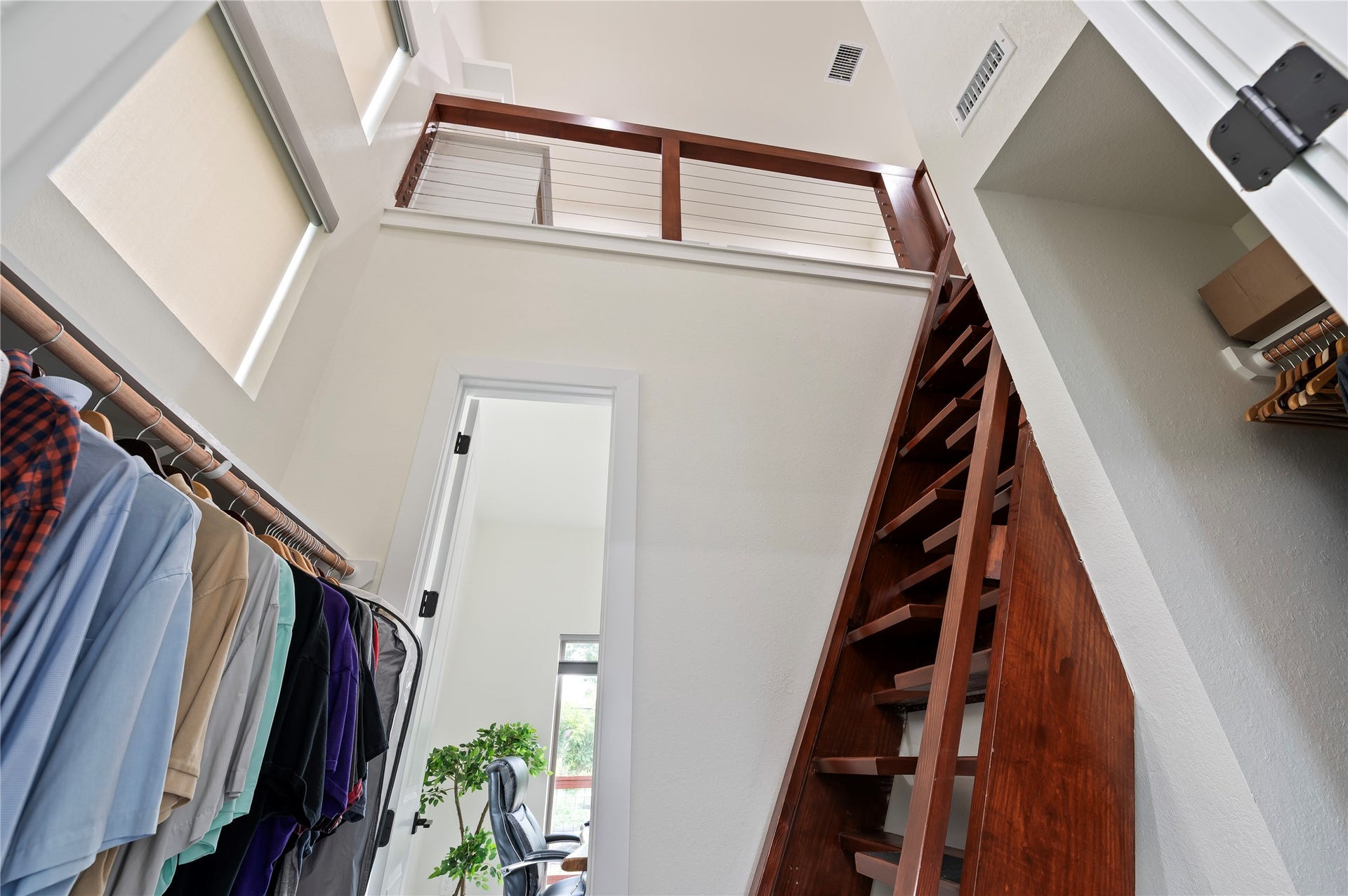 13149 W 6th Street, Santa Fe, TX 77510 Stunning walk-in primary closet with pass through to the study, and Nautical solid oak loft ladder leading to private library.