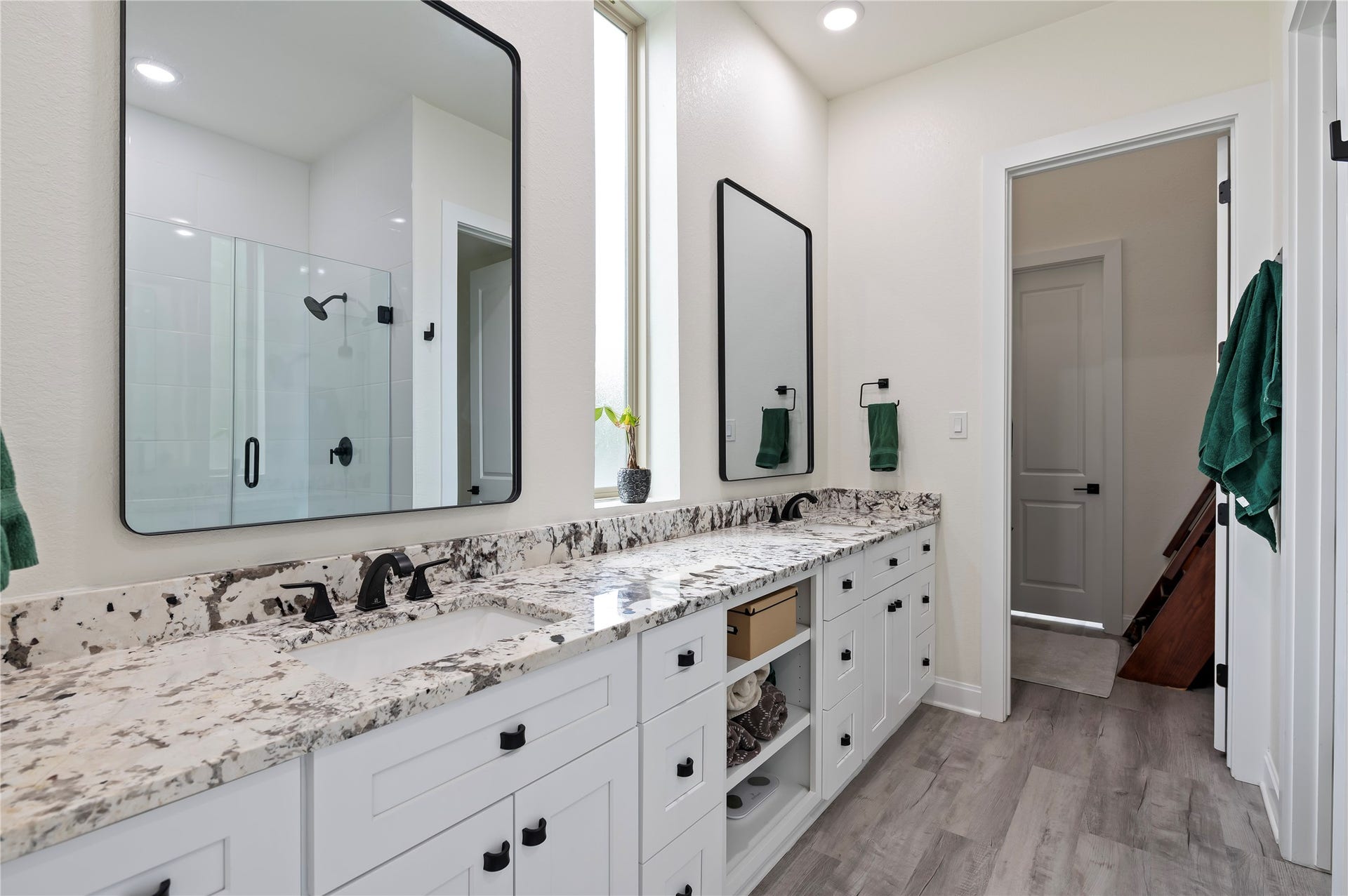 13149 W 6th Street, Santa Fe, TX 77510 Gorgeous primary bathroom features Alaskan White Granite countertops with custom hardware, ample storage drawers and shelves, dual vanities and 3 custom mirrors.