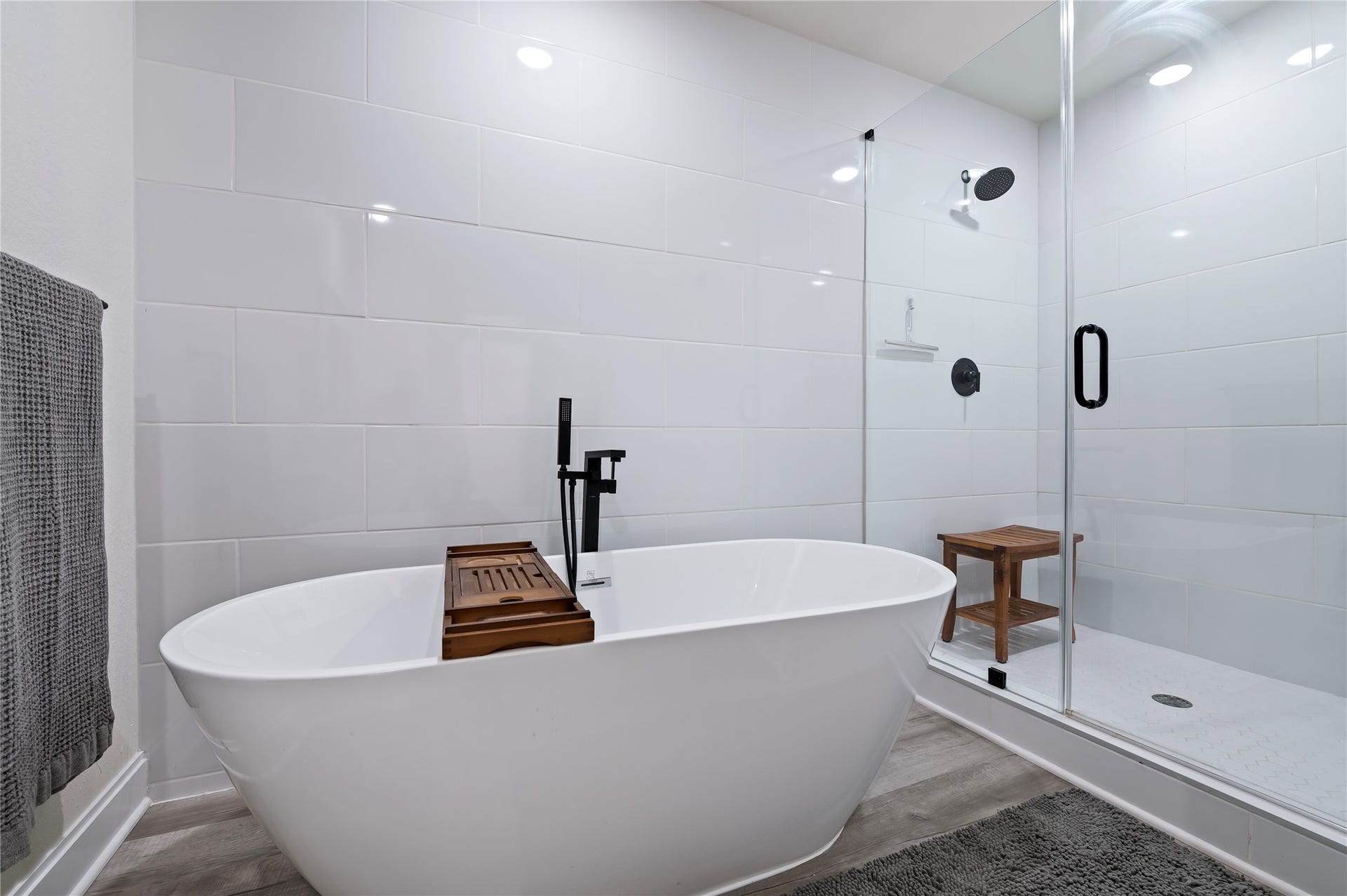 13149 W 6th Street, Santa Fe, TX 77510 Relax in the large freestanding soaking tub or enjoy the oversized walk-in glass shower with White Porcelain tile surrounding in the upstairs full bathroom.