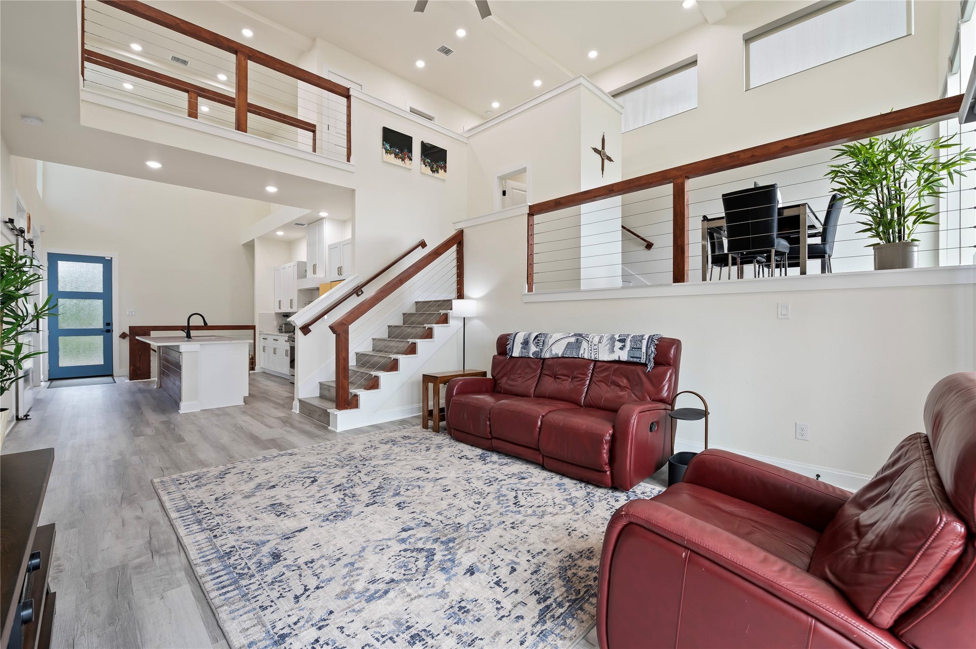 13149 W 6th Street, Santa Fe, TX 77510 Desirable Rexford Model open concept floor plan with coated horizontal cable stairway and catwalk with cedar railing throughout; upgraded ceiling fan too.