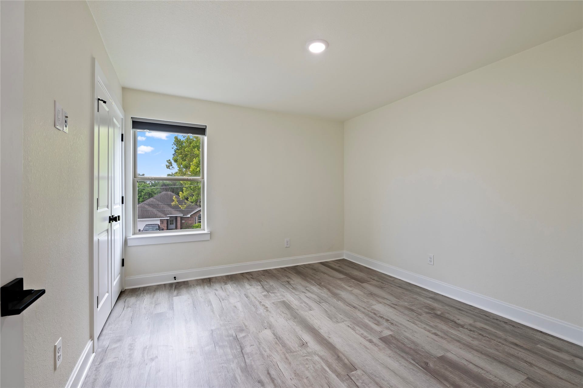 13149 W 6th Street, Santa Fe, TX 77510 3rd bedroom is also spacious with vinyl plank flooring and large closet space.