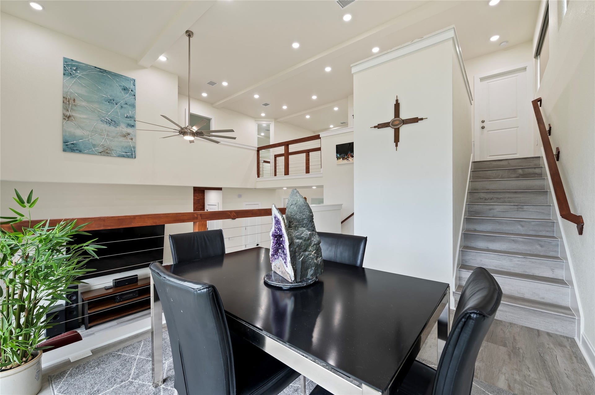 13149 W 6th Street, Santa Fe, TX 77510 Soaring 20-foot ceilings and COREtec Pro Plus Vinyl Plank in Chesapeake Oak and LED lighting throughout.
