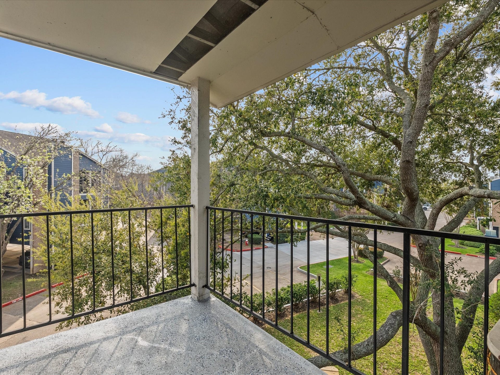 18519 Egret Bay Boulevard, #1802, Webster, TX 77058 Nice balcony view with mature trees.