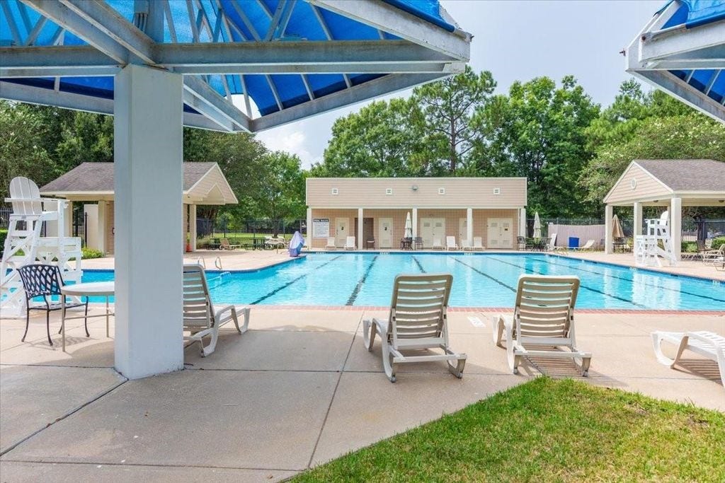 1043 Danforth Drive, Houston, TX 77062 Enjoy resort-style living with this spacious community pool, featuring ample seating, shaded areas, and well-maintained surroundings perfect for relaxation and leisure.