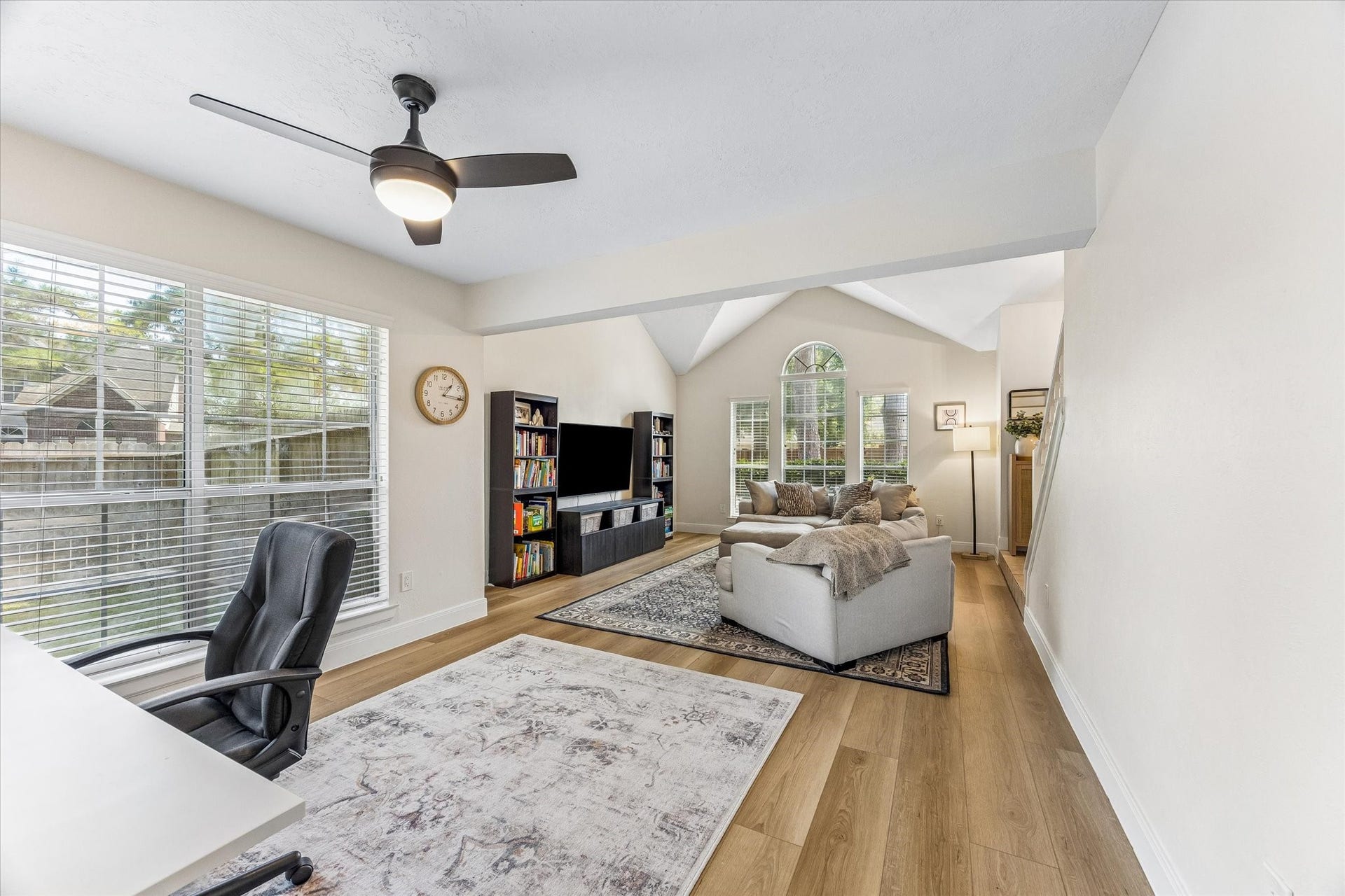 1043 Danforth Drive, Houston, TX 77062 Bright and inviting living space featuring vaulted ceilings, large windows for natural light, and a comfortable seating area perfect for relaxation.