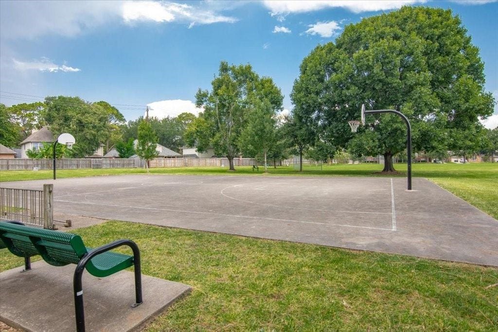 1043 Danforth Drive, Houston, TX 77062 Expansive basketball court set in a lush green park, ideal for outdoor recreation and relaxation.