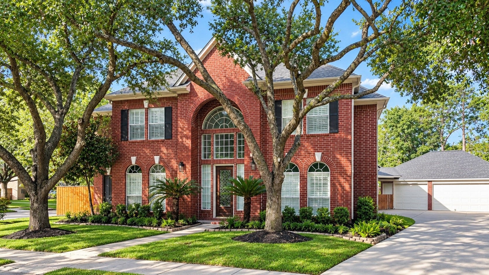 5510 Cherry Creek Bend Court, Houston, TX 77041 Charming elevation with lush, mature trees.