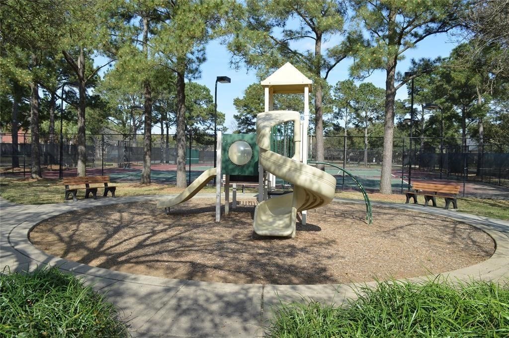 5510 Cherry Creek Bend Court, Houston, TX 77041 Family-friendly amenities include a playground next to the tennis courts, conveniently located near the property.