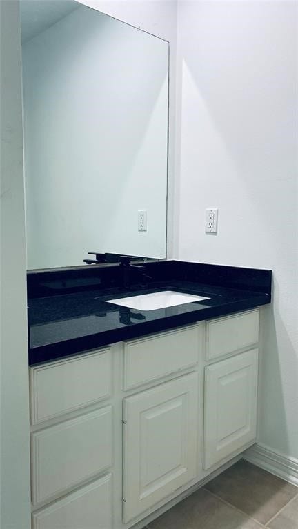 5510 Cherry Creek Bend Court, Houston, TX 77041 This elegant Jack and Jill bathroom features a sleek black countertop and ample storage, perfect for shared convenience and style.