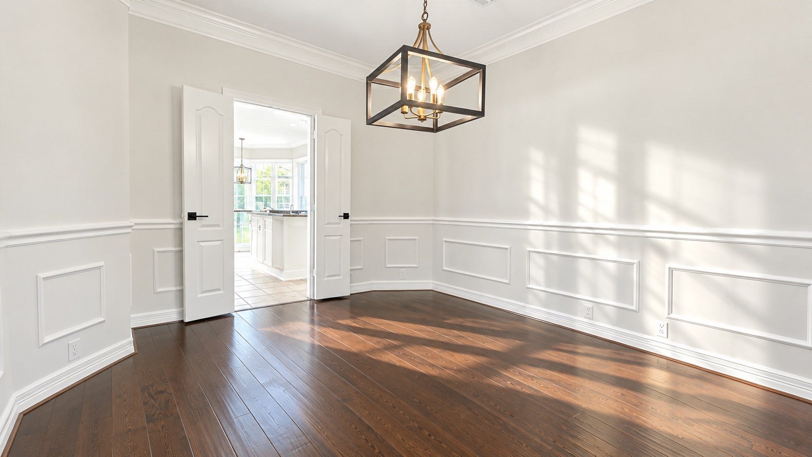 5510 Cherry Creek Bend Court, Houston, TX 77041 Elegant dining room featuring rich wood flooring and seamless kitchen access.