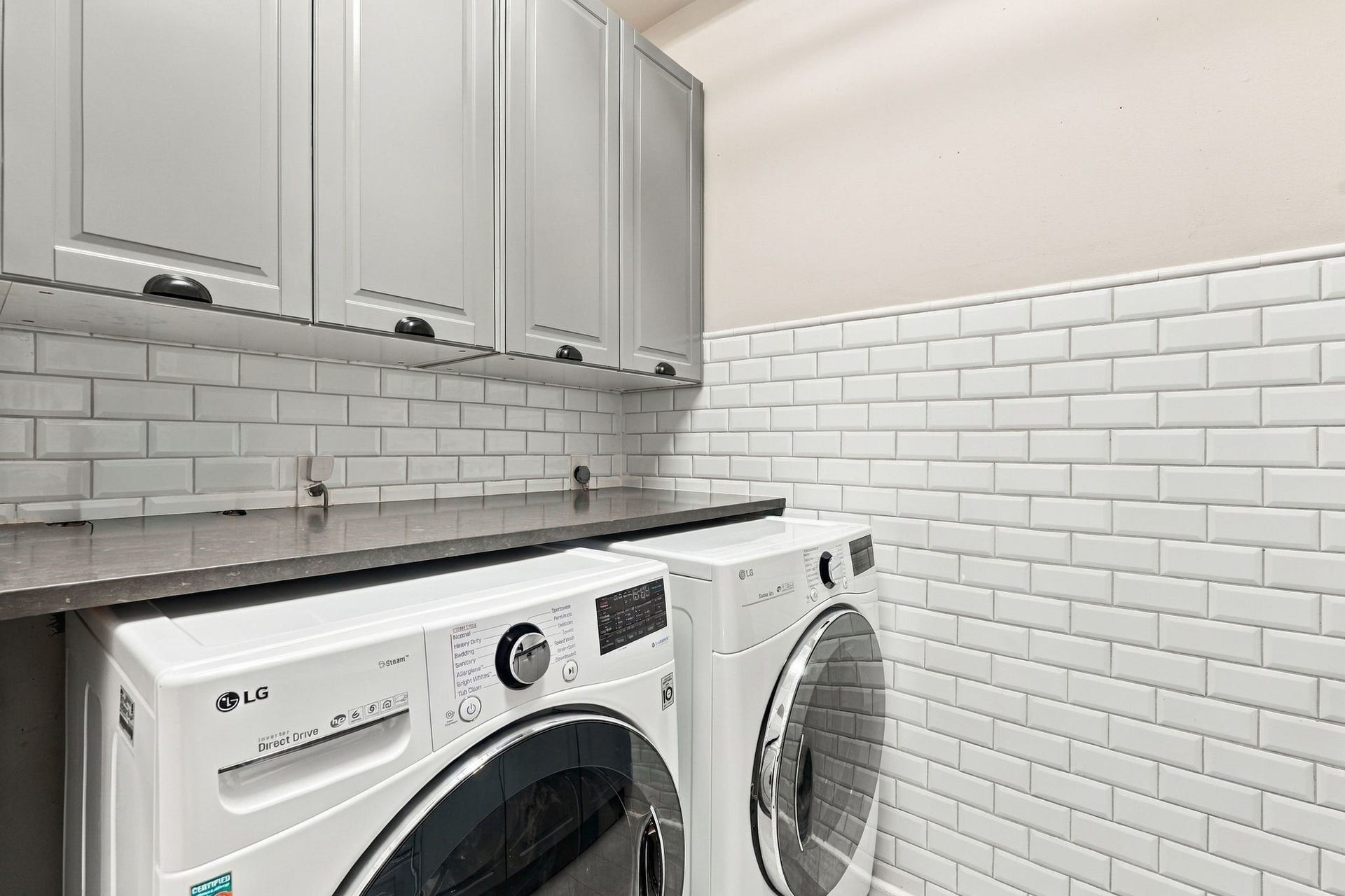 22 Hillside View Place, The Woodlands, TX 77381 The laundry room offers plenty of storage and space to fold and organize your clothing. Washer and dryer convey with the home.