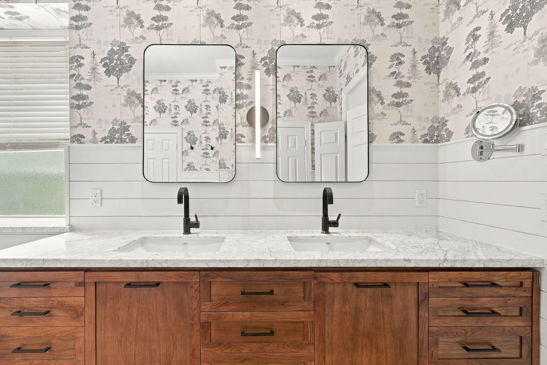 22 Hillside View Place, The Woodlands, TX 77381 Expansive dual vanity offers abundant storage and counter space complemented by warm wood cabinetry and designer finishes.