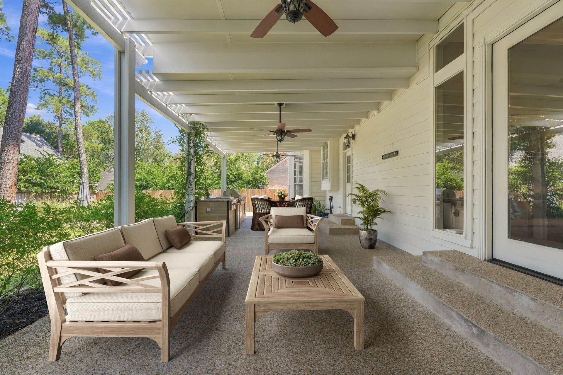 22 Hillside View Place, The Woodlands, TX 77381 Enjoy relaxing evenings on this large covered patio overlooking the serene wooded backyard. VIRTUALLY STAGED