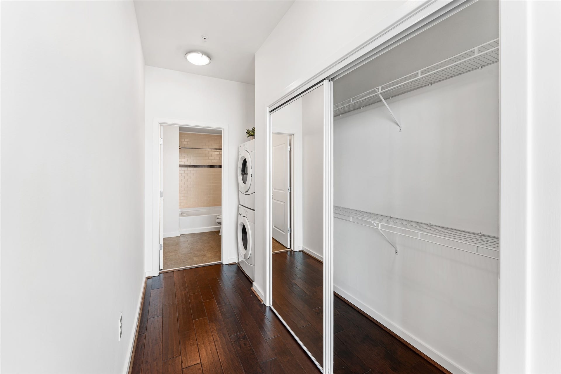 5925 Almeda Road, #12711, Houston, TX 77004 Closet with full length mirror and laundry area.