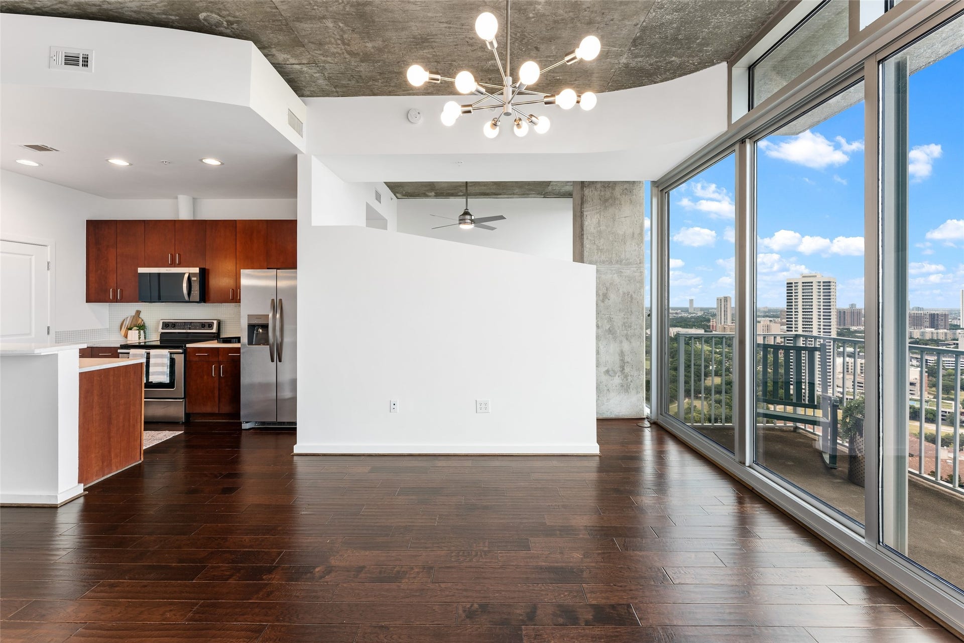 5925 Almeda Road, #12711, Houston, TX 77004 The living room offers warm flooring with stylish ceilings.