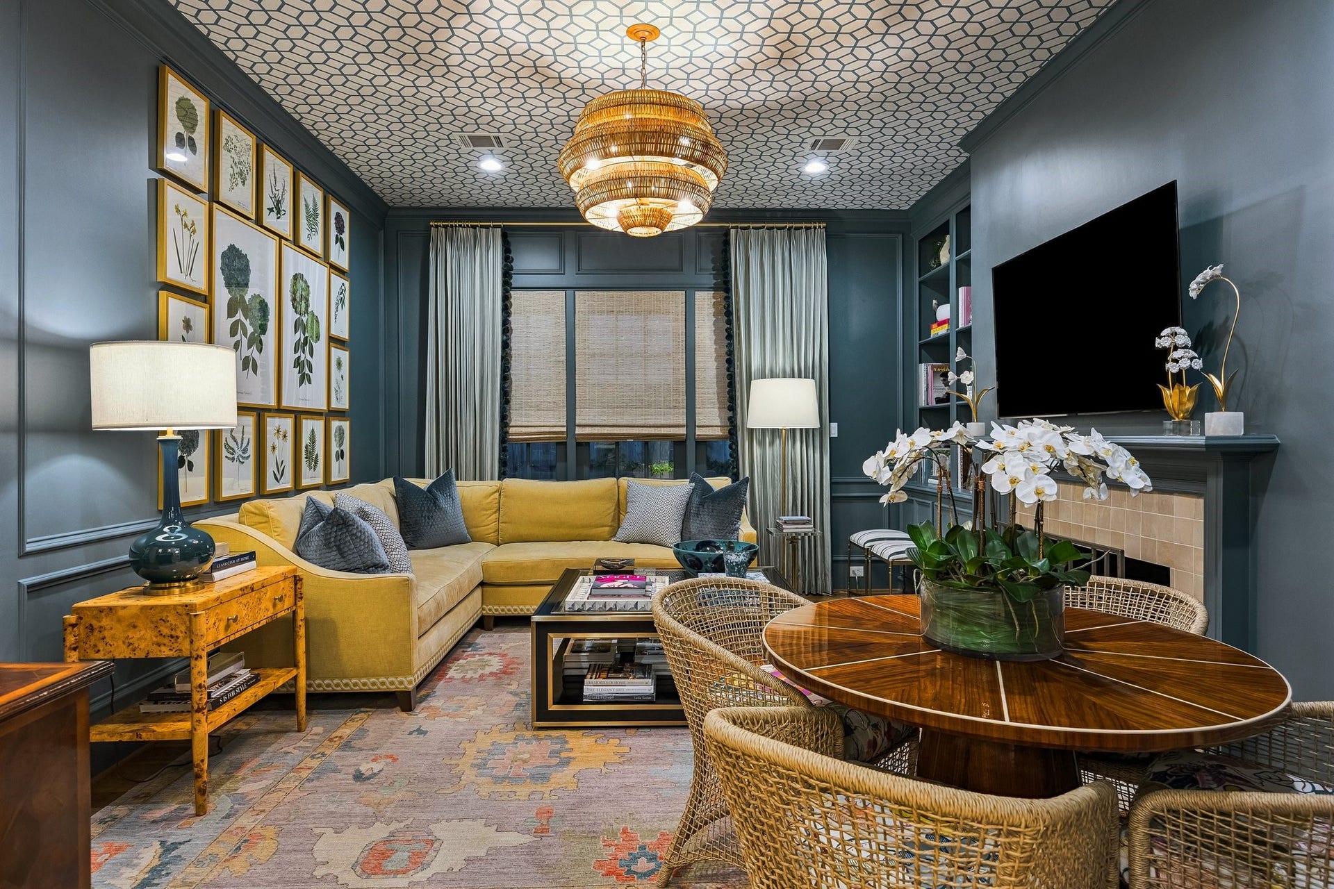 19 E Briar Hollow Lane, Houston, TX 77027 Closer view of the paneled painted walls and papered ceiling - accented by a striking central light fixture and recessed lighting.