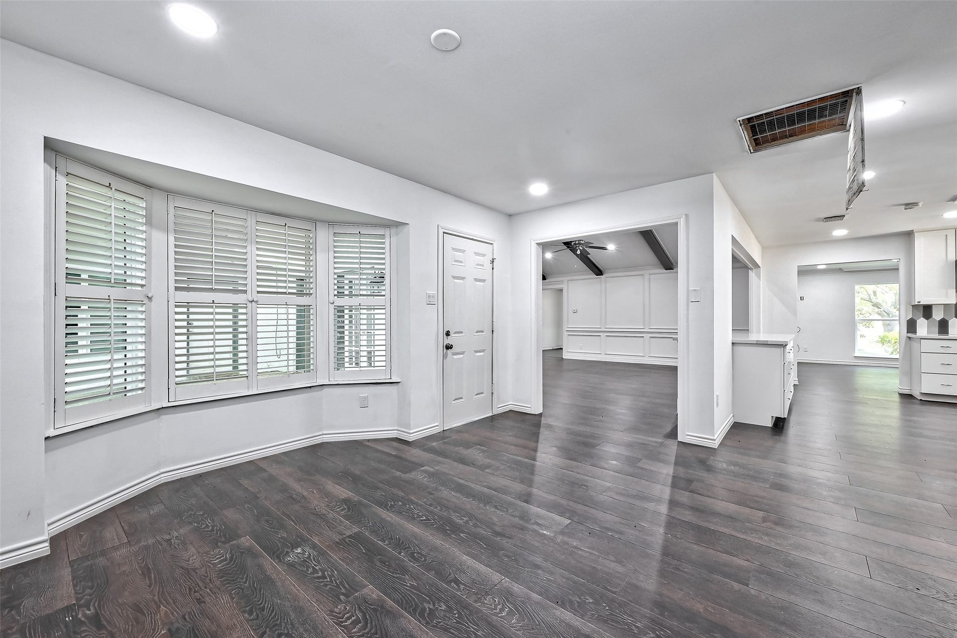 Breakfast area is with large windows overlook the back covered patio and yard.