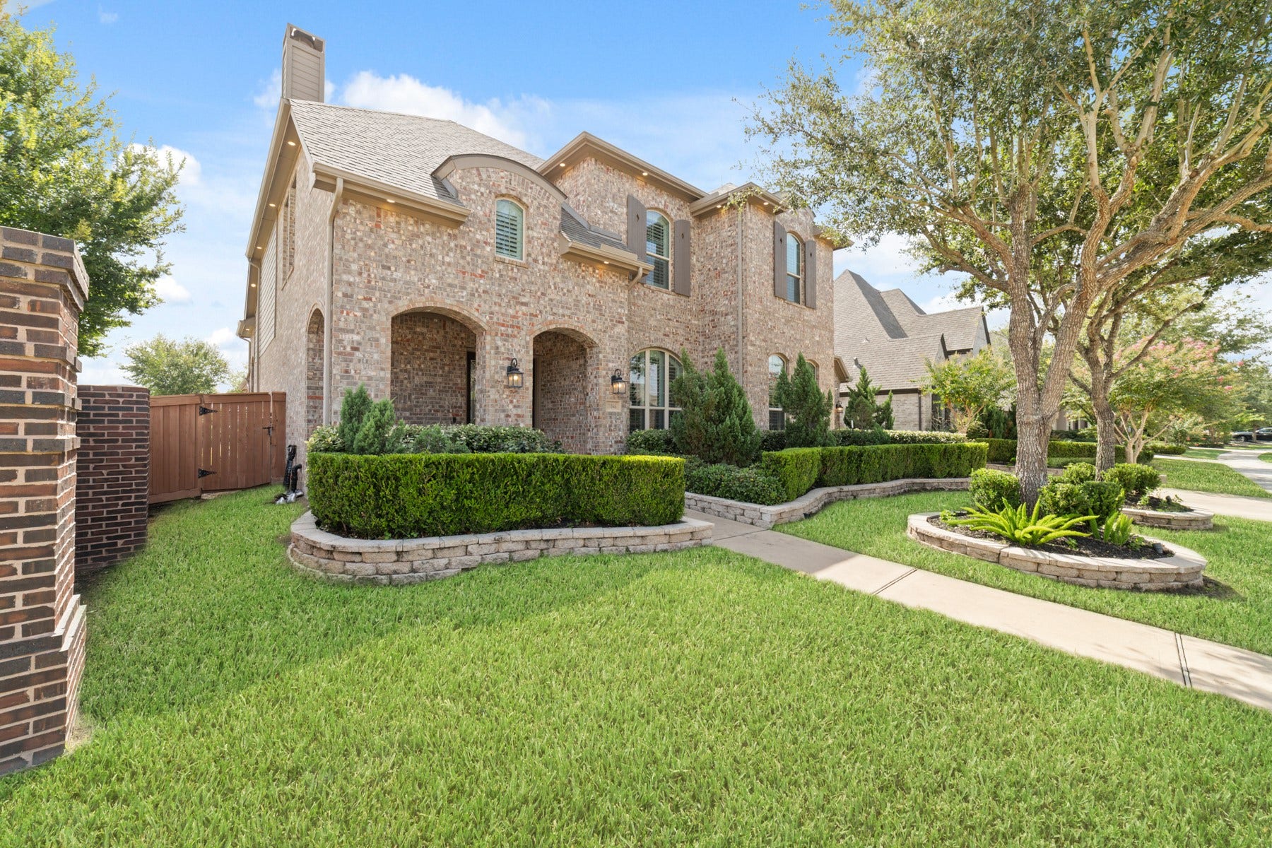 Elegant arched windows, and a welcoming pathway.