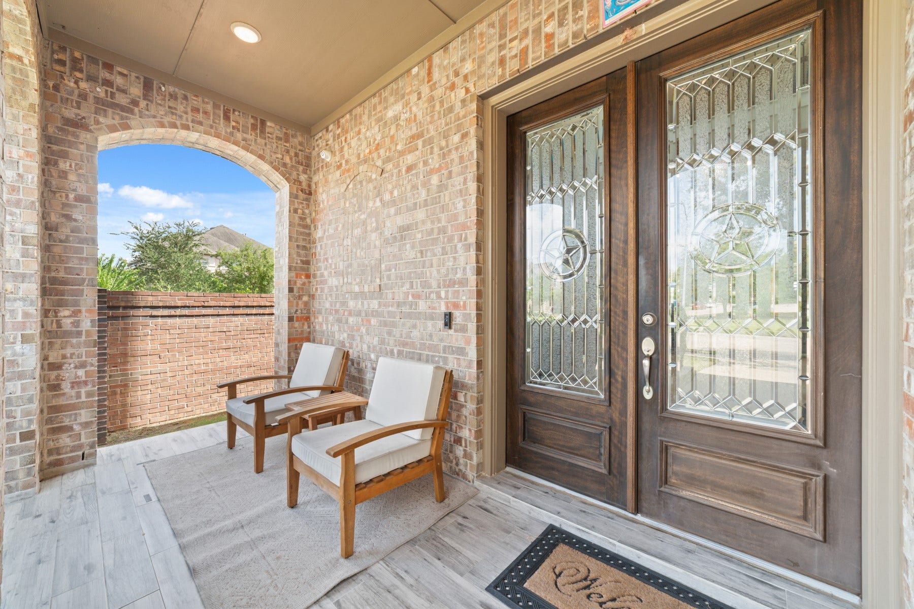 Elegant double doors and cozy seating, perfect for relaxation.