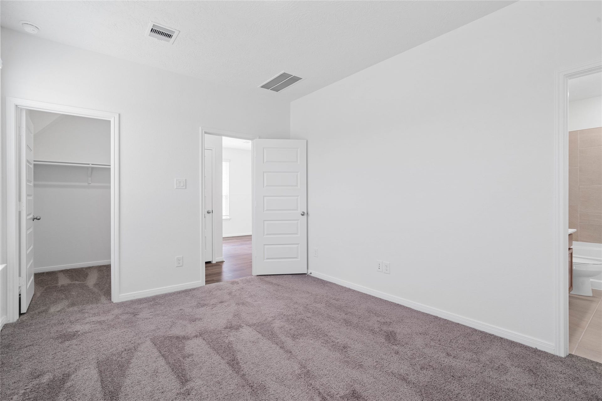 640 Appaloosa Meadow Drive, Magnolia, TX 77354 Additional view of the primary bedroom looking towards the primary bathroom and walk-in closet.