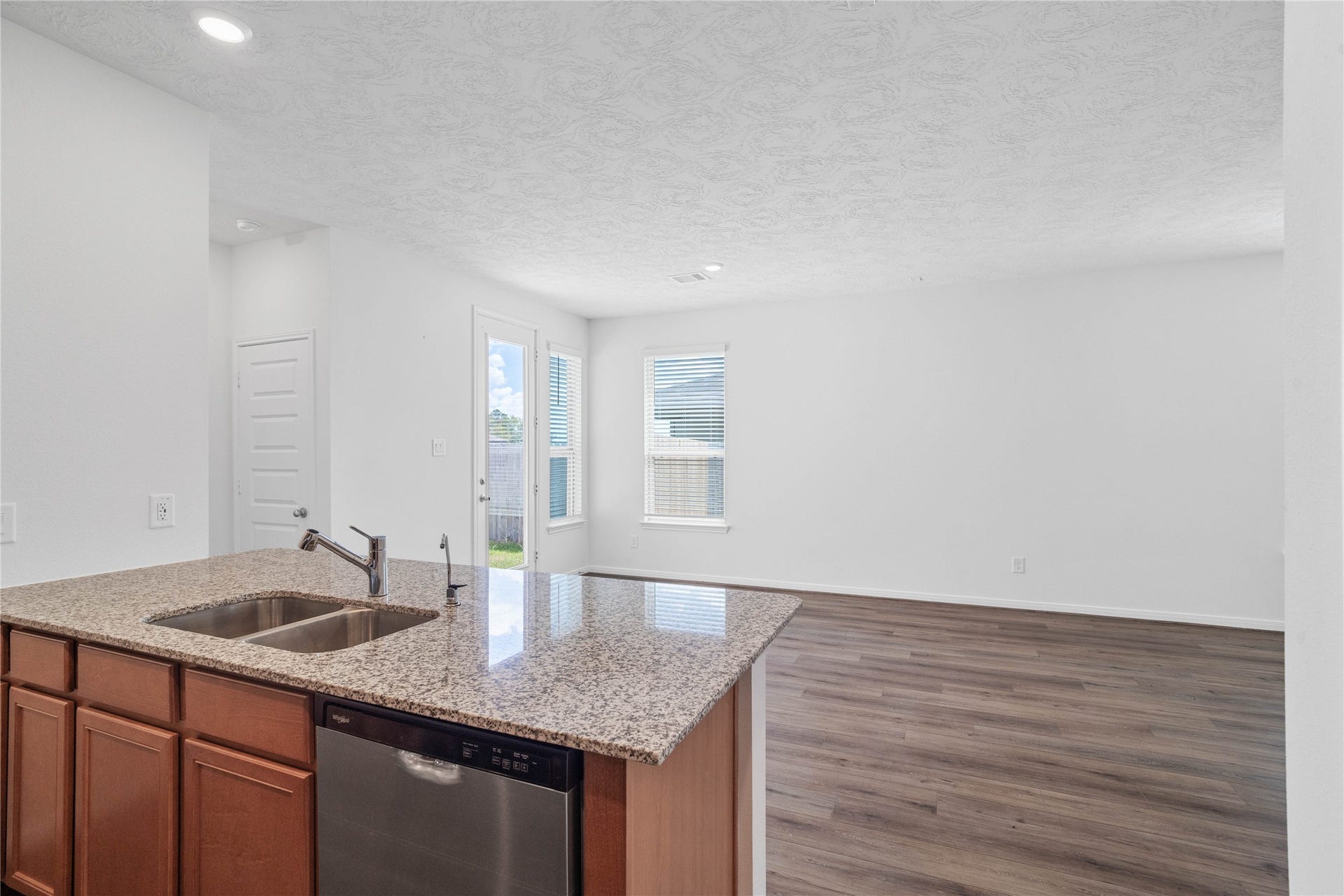 640 Appaloosa Meadow Drive, Magnolia, TX 77354 Beautiful open-concept layout effortlessly uniting the family, dining, and kitchen spacesideal for everyday comfort and entertaining guests!
