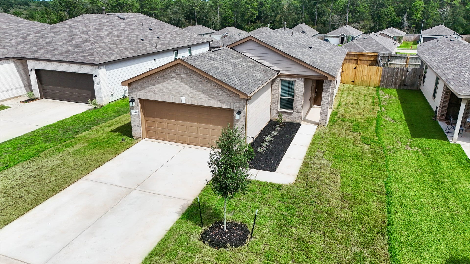 640 Appaloosa Meadow Drive, Magnolia, TX 77354 Additional aerial photo showcasing the spacious side yard.