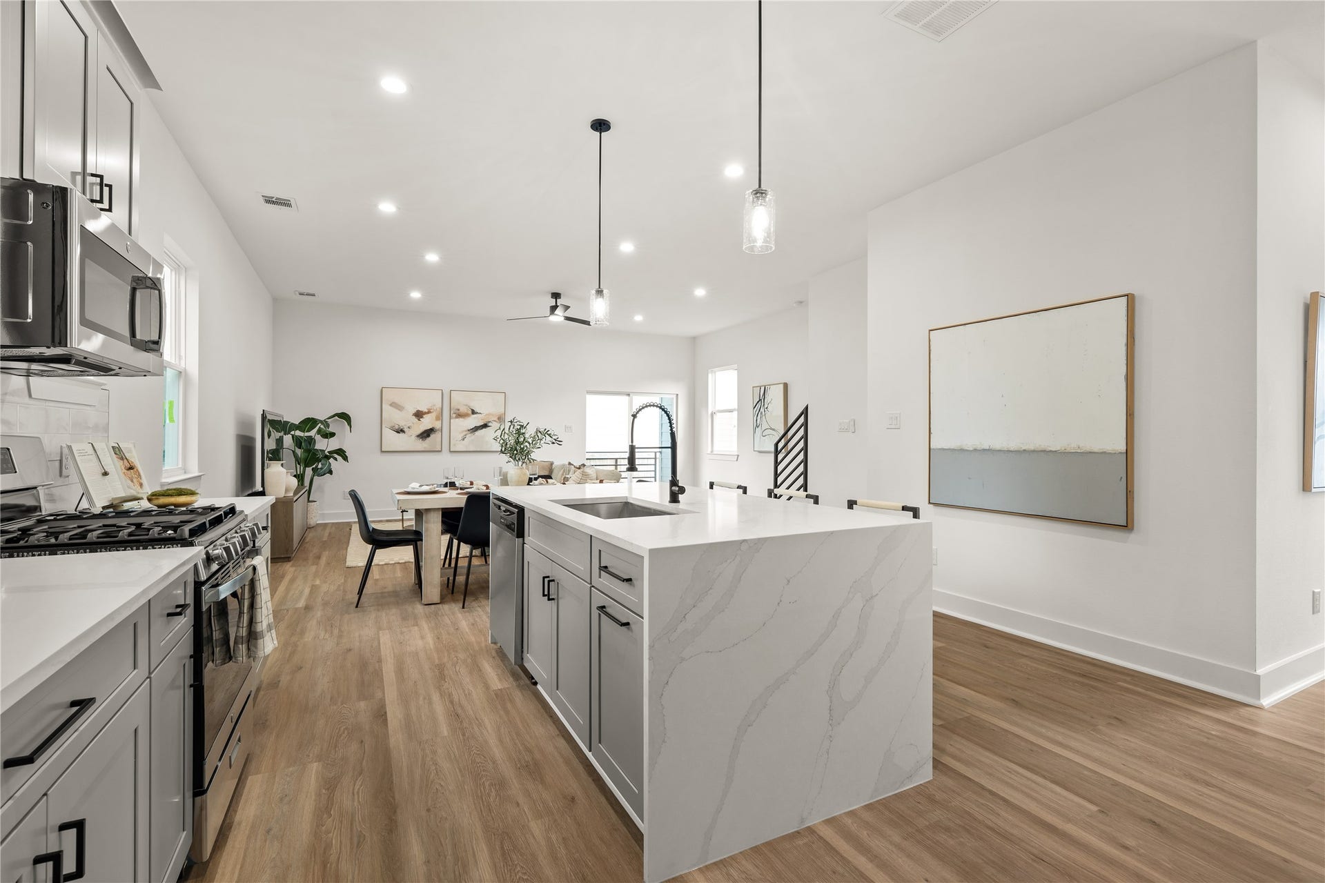 3412 Cortlandt Street, Houston, TX 77018 A closer view reveals the kitchen's working details, including stainless steel appliances, a glossy subway
tile backsplash, and generous drawer storage, all arranged in a layout that makes everyday cooking feel
effortless.
